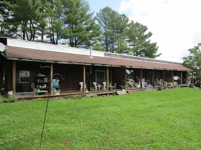 back of property with a lawn