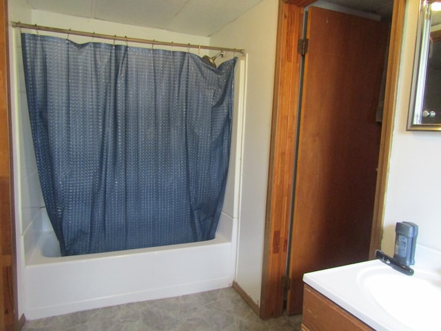 bathroom featuring vanity and shower / bath combination with curtain