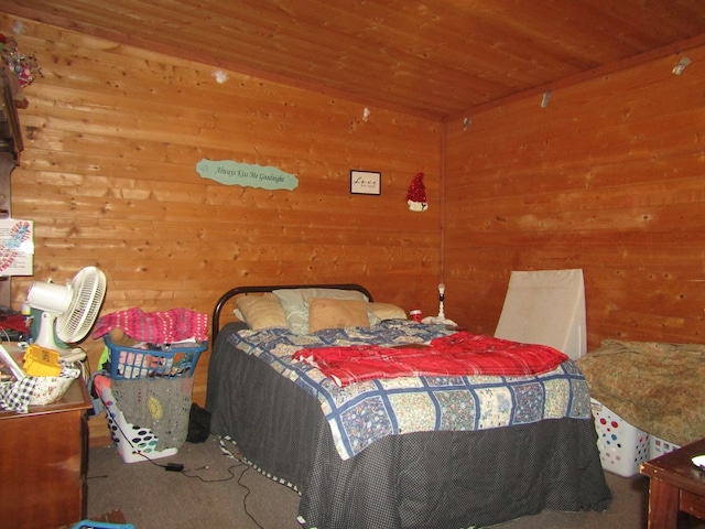 bedroom with wooden walls