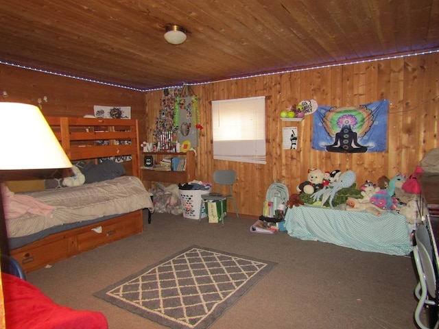 bedroom with carpet flooring and wood walls