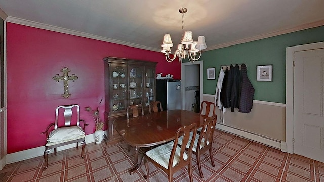 dining space featuring ornamental molding, a chandelier, and a baseboard heating unit