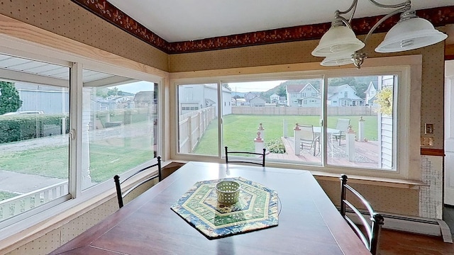 dining space featuring baseboard heating