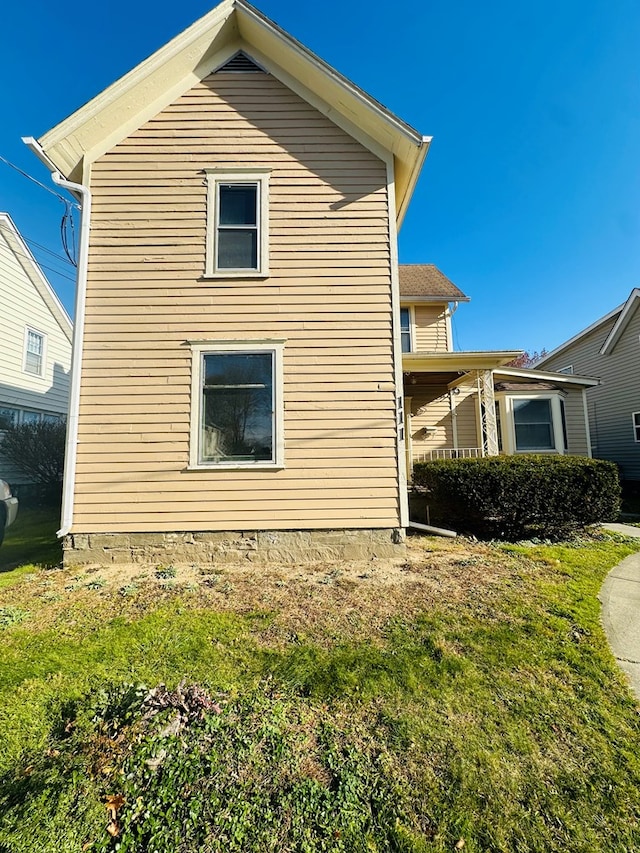 view of home's exterior featuring a lawn