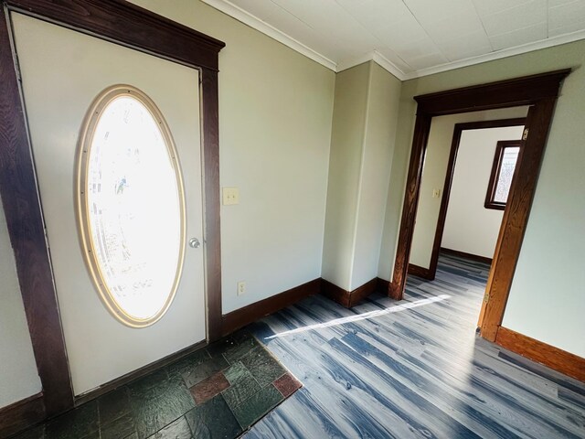 foyer entrance featuring ornamental molding