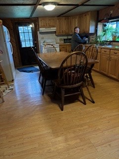 dining area with a healthy amount of sunlight and light hardwood / wood-style flooring