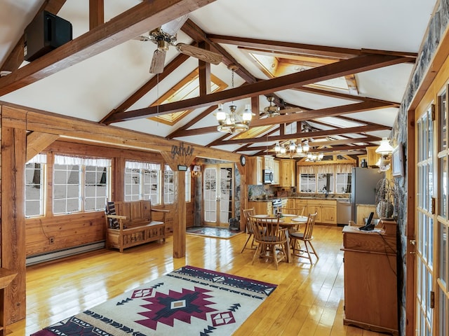 interior space featuring light hardwood / wood-style flooring, french doors, baseboard heating, high vaulted ceiling, and beamed ceiling