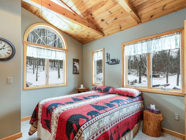 bedroom with wood ceiling, multiple windows, vaulted ceiling with beams, and carpet flooring