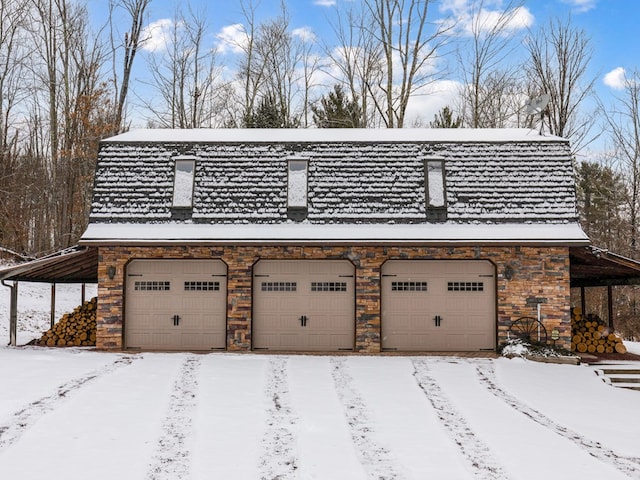 view of snow covered garage