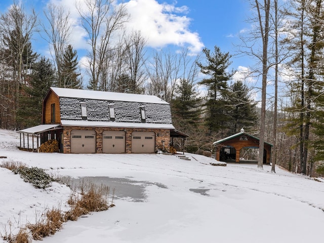 view of snow covered garage