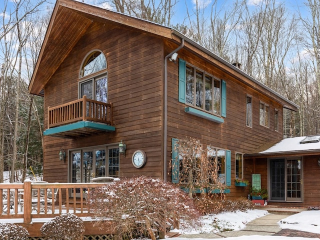 snow covered house with a balcony