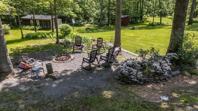 2542 Baldwin Run Rd, Wellsboro, PA 16901 - view of grassy yard featuring a fire pit and an outdoor structure