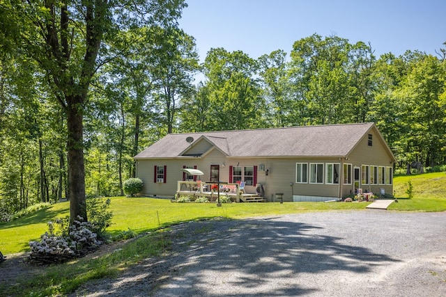 2542 Baldwin Run Rd, Wellsboro, PA 16901 - ranch-style house with gravel driveway, a deck, and a front yard