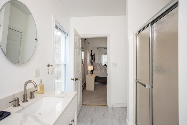 full bathroom with a shower stall, ensuite bathroom, and vanity