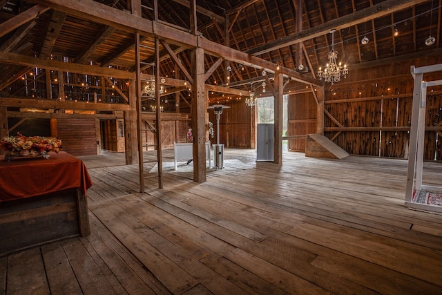 misc room with a chandelier and hardwood / wood-style floors