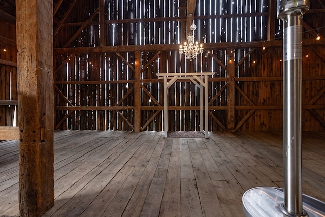 misc room featuring a notable chandelier and hardwood / wood-style floors