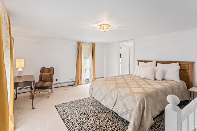 carpeted bedroom featuring a baseboard radiator