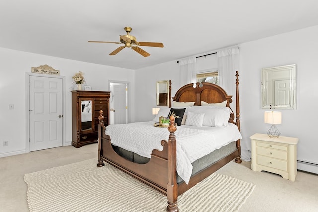 bedroom featuring baseboard heating, light carpet, ceiling fan, and baseboards