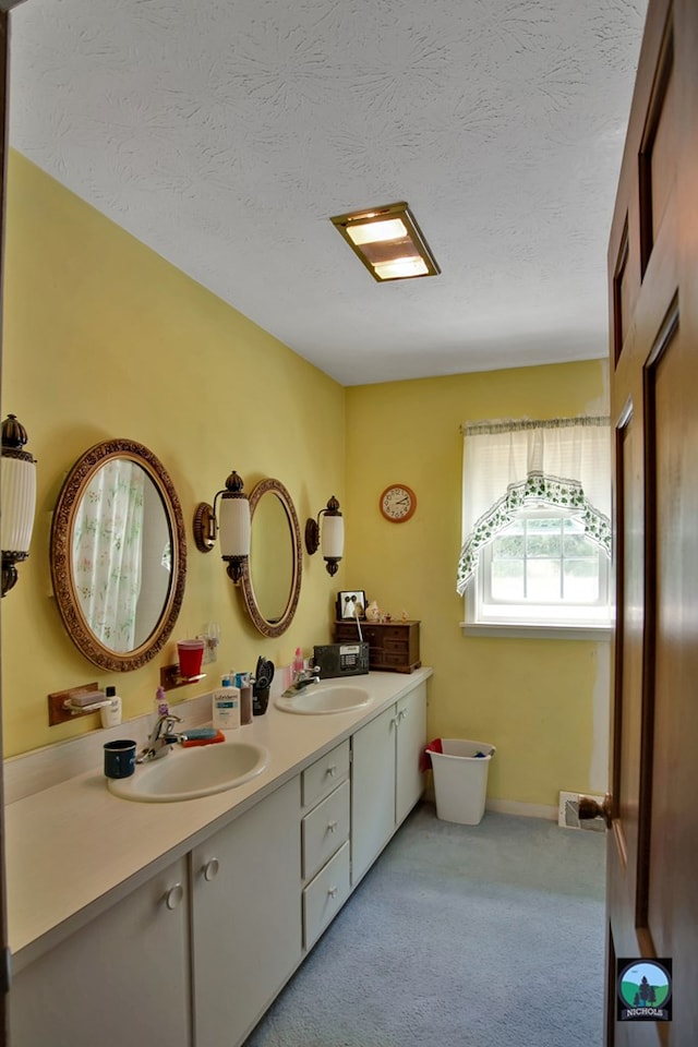 bathroom featuring vanity and a textured ceiling