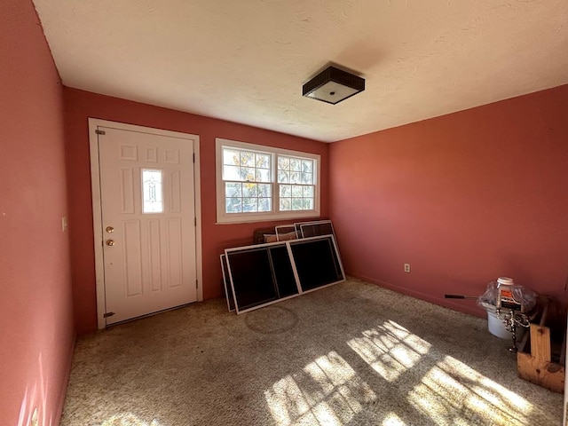 entryway with carpet floors