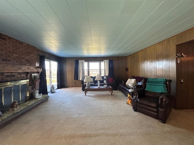 carpeted living room with a fireplace