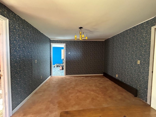 unfurnished room featuring an inviting chandelier