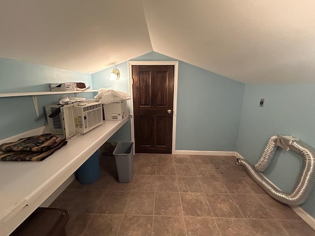 bathroom featuring vaulted ceiling