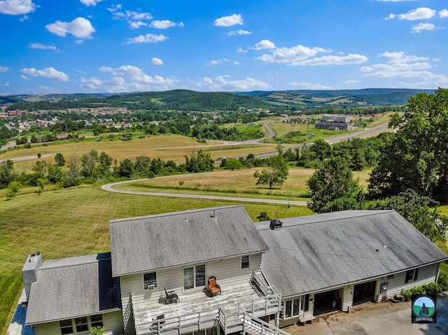 birds eye view of property with a mountain view