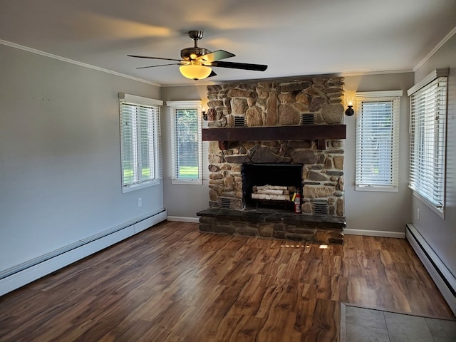 unfurnished living room featuring baseboard heating, a stone fireplace, ceiling fan, and ornamental molding