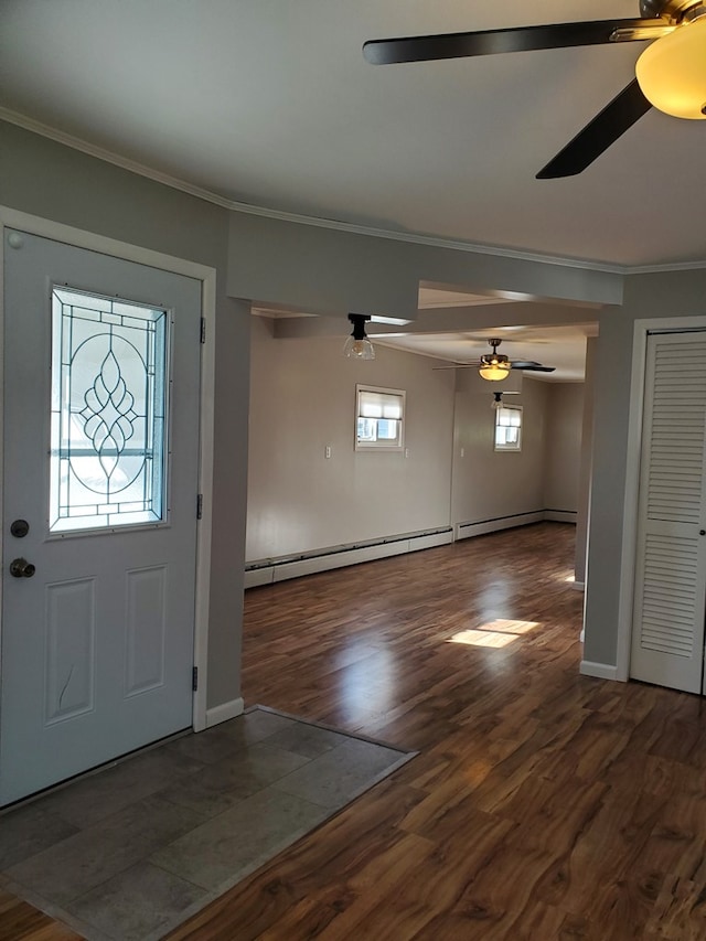 entryway featuring dark hardwood / wood-style floors, crown molding, and a baseboard radiator