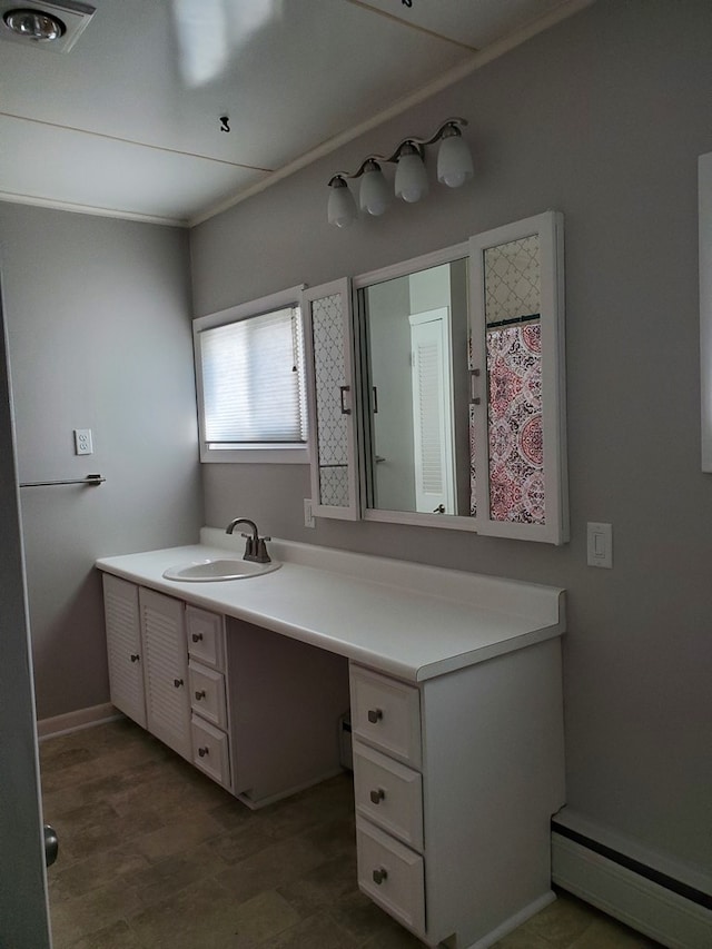 bathroom with vanity, wood-type flooring, and a baseboard radiator