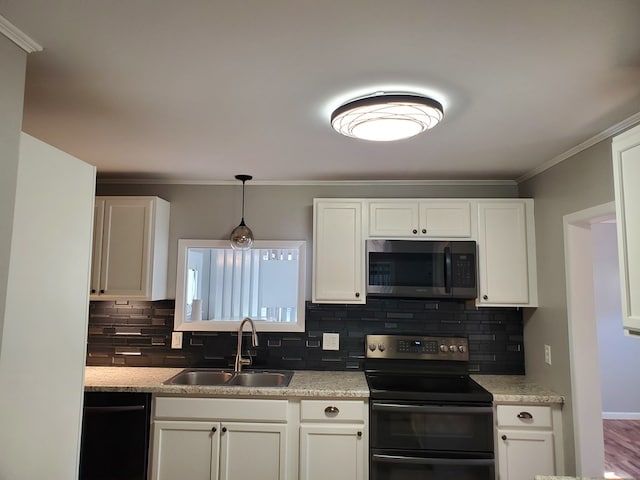 kitchen featuring white cabinets, stainless steel appliances, tasteful backsplash, and sink