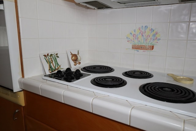 1 Mechanic St, Towanda, PA 18848 - kitchen view of decorative backsplash, tile counters, and extractor fan
