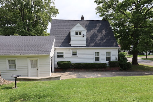 1 Mechanic St, Towanda, PA 18848 - rear view of house with a yard, a chimney, and roof with shingles
