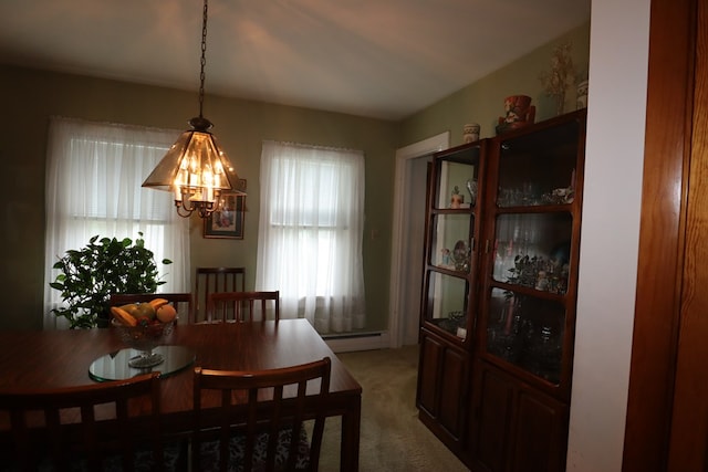 1 Mechanic St, Towanda, PA 18848 - dining space featuring healthy amount of natural light, a chandelier, light colored carpet, and baseboard heating