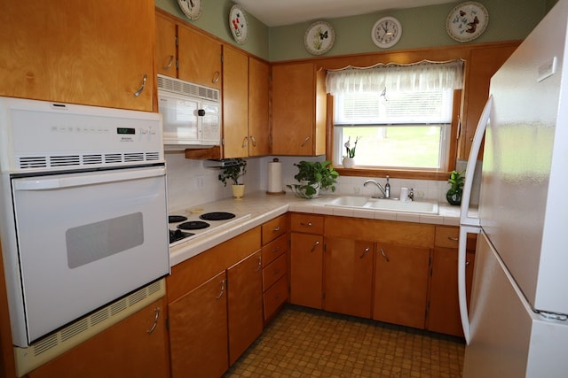 1 Mechanic St, Towanda, PA 18848 - kitchen with white appliances, tasteful backsplash, and brown cabinets