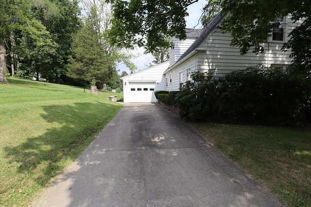 1 Mechanic St, Towanda, PA 18848 - view of side of property featuring a garage, driveway, and a lawn