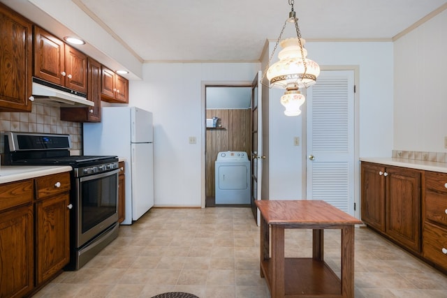 kitchen with washer / dryer, crown molding, gas stove, and under cabinet range hood