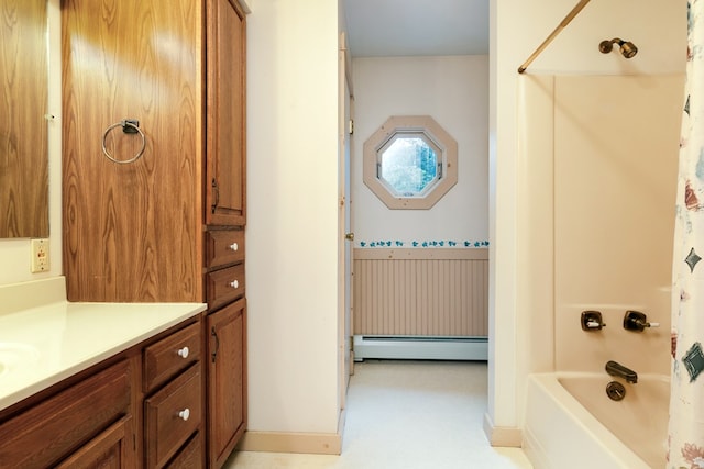 bathroom with baseboard heating, vanity, and shower / bath combo