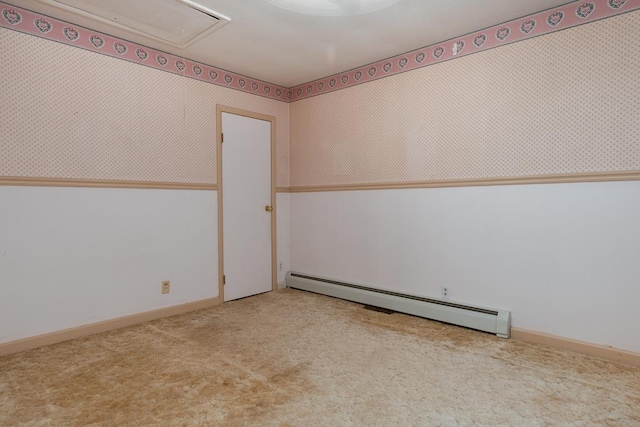 empty room with baseboards, a baseboard radiator, wallpapered walls, attic access, and carpet flooring