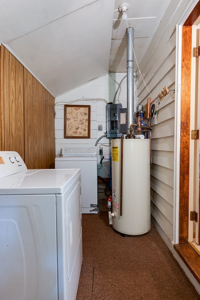 washroom with wooden walls, laundry area, electric panel, separate washer and dryer, and water heater