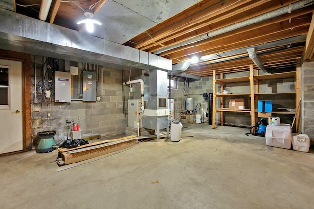 unfinished below grade area with heating unit and electric panel