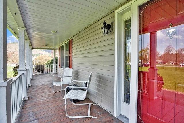 wooden terrace featuring a porch
