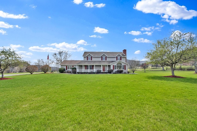 cape cod home with a porch, a front lawn, and a chimney