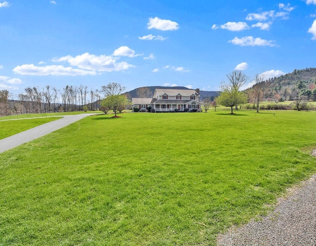 view of property's community with a lawn