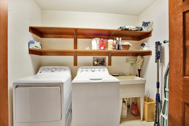laundry room featuring washer and clothes dryer and laundry area
