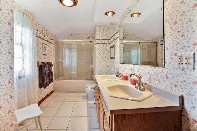 full bathroom with lofted ceiling, wallpapered walls, and a sink