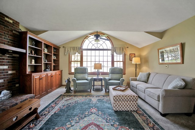 carpeted living area with vaulted ceiling