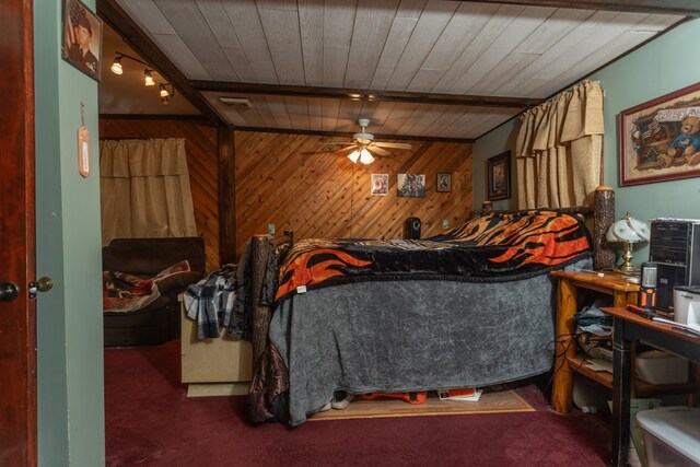 interior space featuring wood walls, beamed ceiling, ceiling fan, and wood ceiling