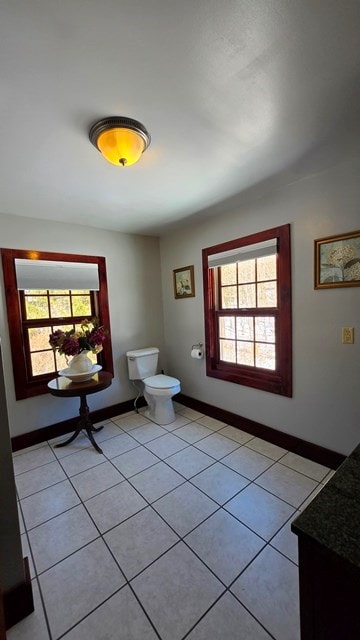 bathroom with tile patterned flooring and toilet