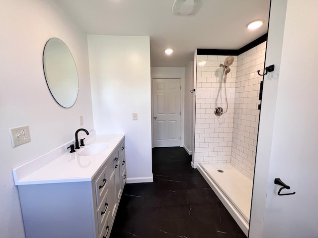 full bathroom with recessed lighting, baseboards, a stall shower, and vanity